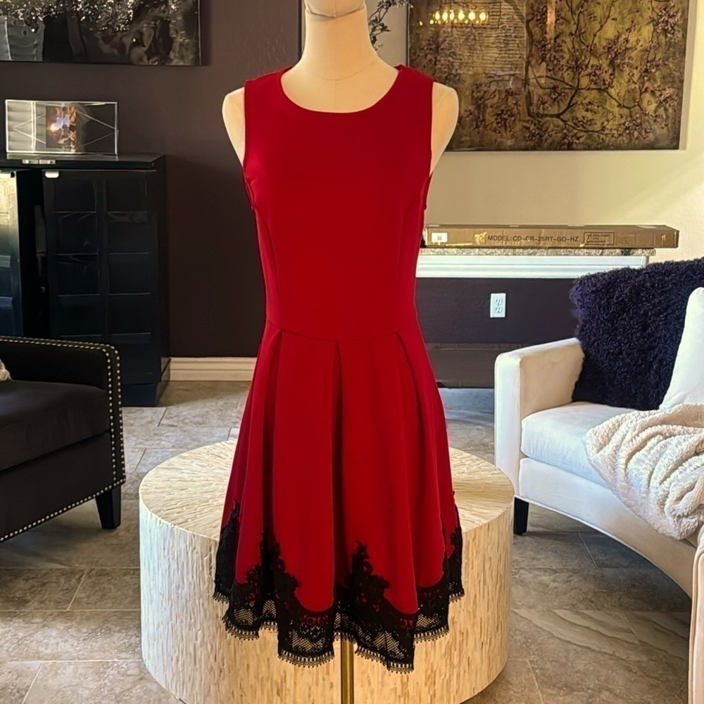 Nwot red dress with black lace trim on the bottom